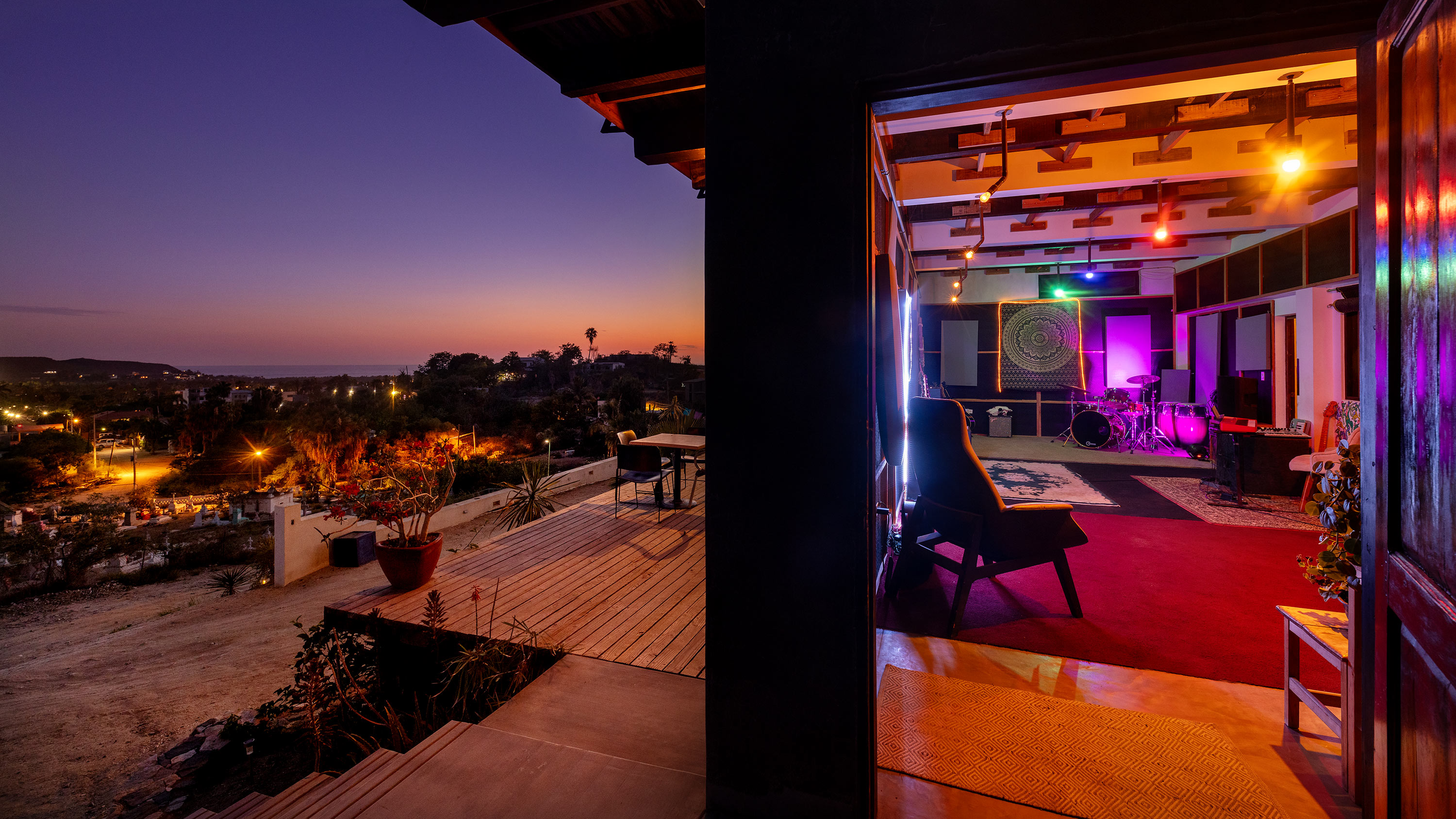 Casa Rosa studio at sunset with desert view and colorful interior lighting