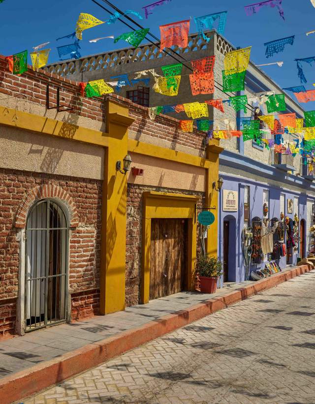 Todos Santos, Mexico - Colorful street with papel picado banners